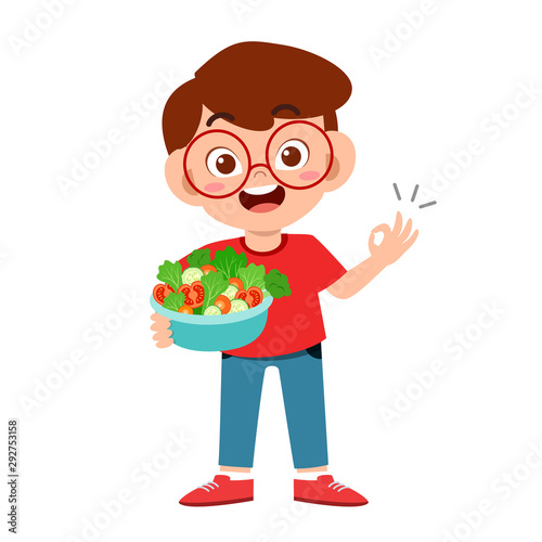 cute happy kid eat salad vegetable fruits