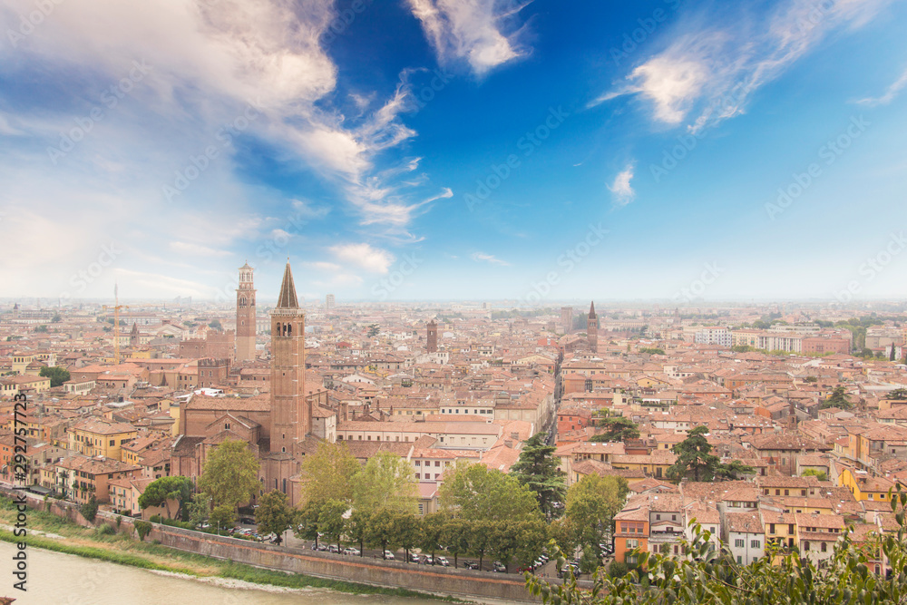 Beautiful view of the panorama of Verona and the Lamberti tower on the banks of the Adige River in Verona, Italy