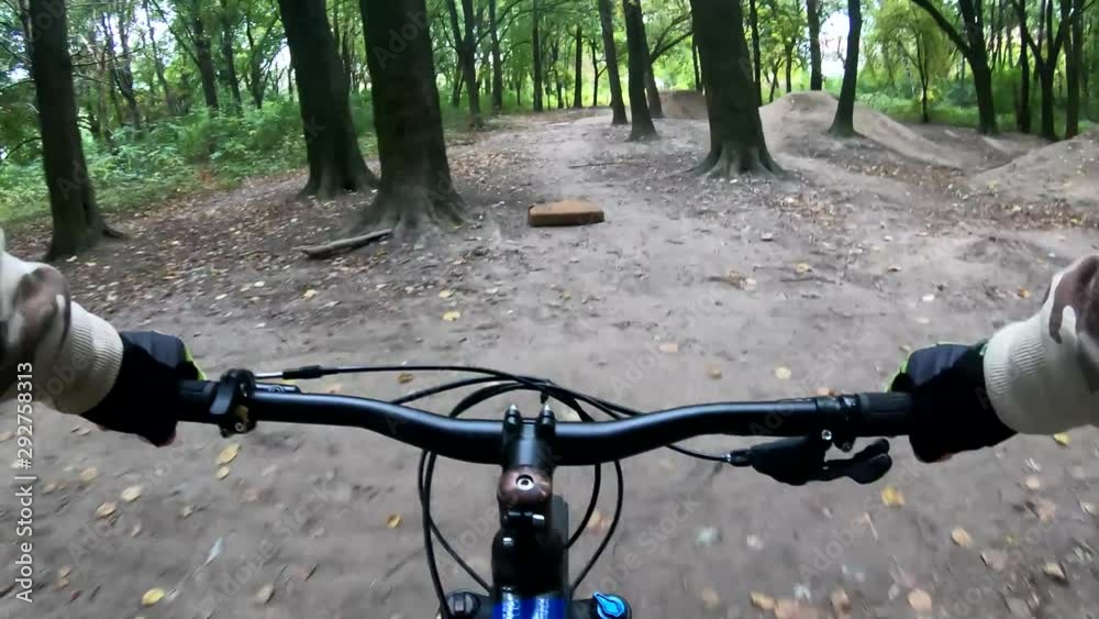 Amateur rider on the MTB bicycle on the trails in the autumn season Amateur rider on the MTB bicycle on the trails in the autumn season