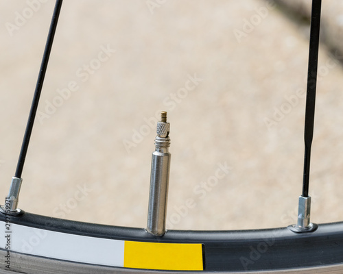 Closeup detail of bicycle tire valve stem in the 