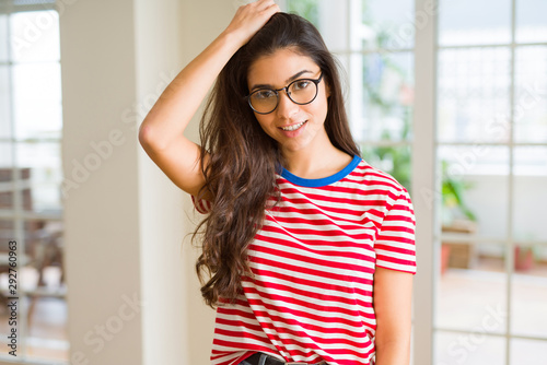 Young beautiful woman smiling cheerful wearing glasses looking happy with a big smile Free Download Young beautiful woman smiling cheerful wearing glasses looking happy with a big smile - GFXLoad