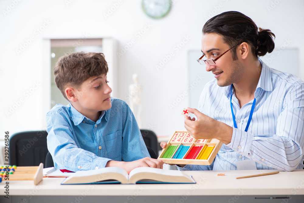 Young father helping his son to prepare for exam Young father helping his son to prepare for exam