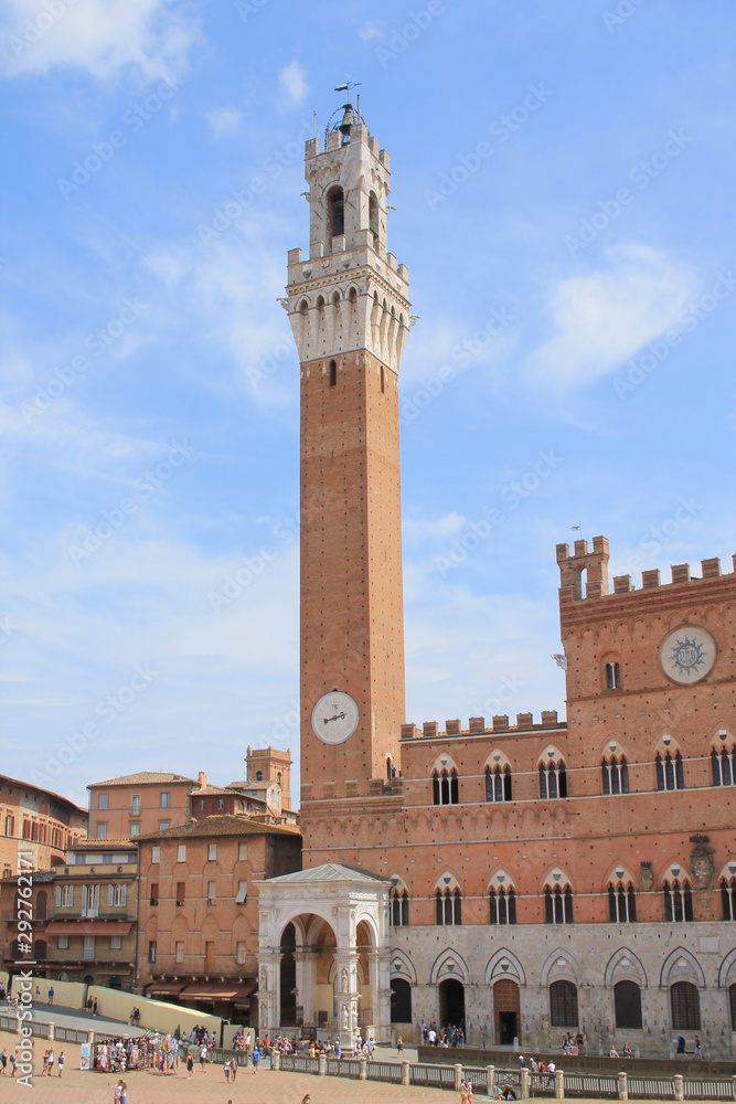 Piazza del Campo with the Pubblico palace and Mangia tower , the principal public space of the historic center of Siena, Tuscany, Italy. It is regarded as one of Europe's greatest medieval squares