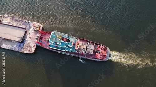 Cargo ship on the river view from the height of the quadcopter