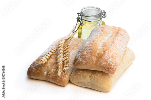 Italian slyle bread ciabatta with olive oil isolated on white photo