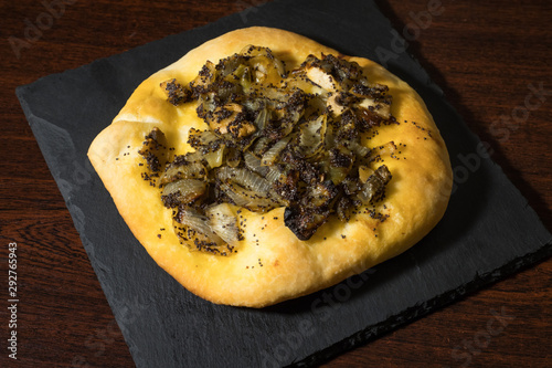 Homemade cebularz, Traditional Polish pancake with onion and common poppy seeds, from Jewish tradition, baked in Lublin, Poland. photo