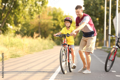 Father teaching his son to ...