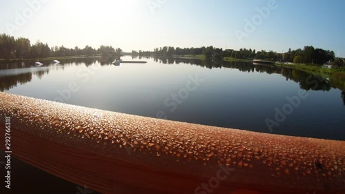 Dew Drops On A Wooden Bridge. Slow Motion photo