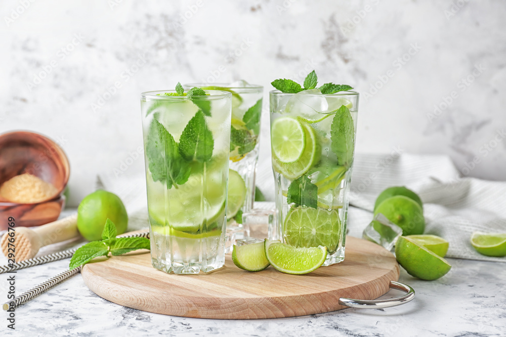 Fototapeta premium Glasses of fresh mojito on table