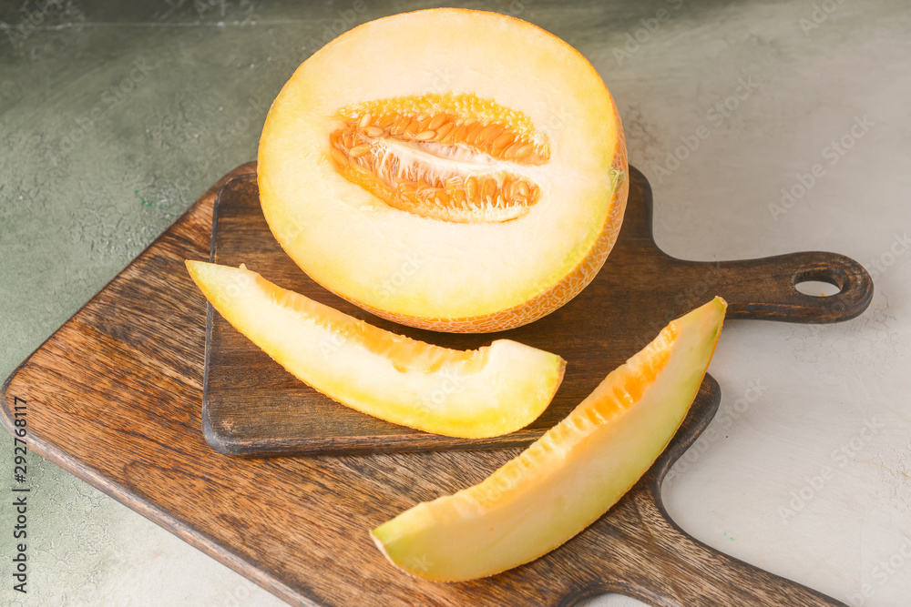 Sweet cut ripe melon on table