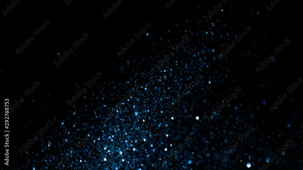Blue Glitter Background in Super Slow Motion at 1000fps. Shooted with High Speed Cinema Camera in 4K Resolution. Blue Glitter Background in Super Slow Motion at 1000fps. Shooted with High Speed Cinema Camera in 4K Resolution.