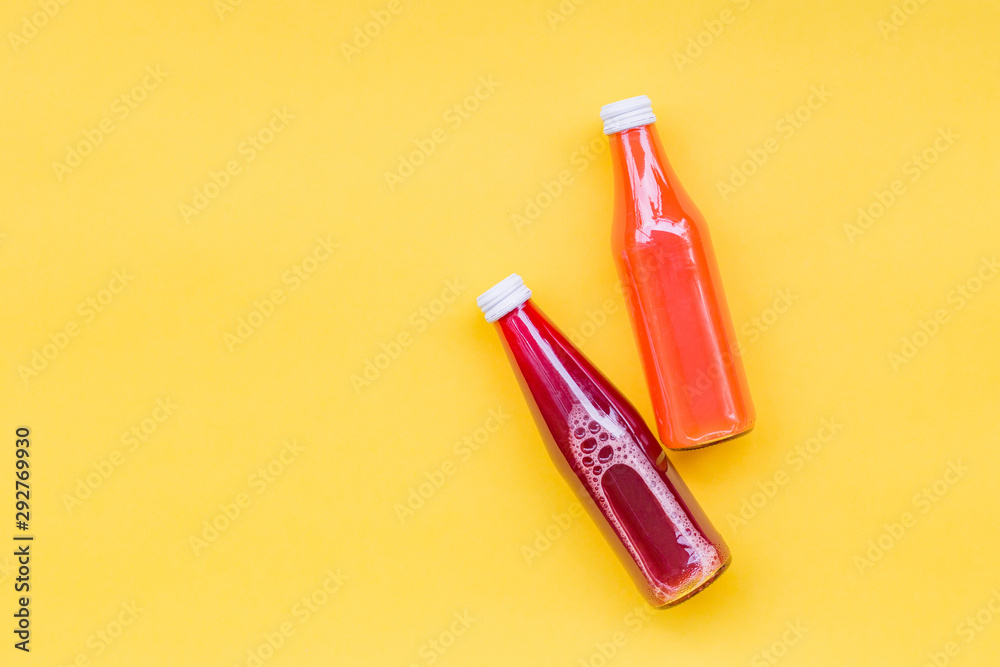 Juice Bottle Mock-Up, two gradient juice bottles on yellow background. Variety of colorful Smoothies, top view. Healthy Food concept Juice Bottle Mock-Up, two gradient juice bottles on yellow background. Variety of colorful Smoothies, top view. Healthy Food concept