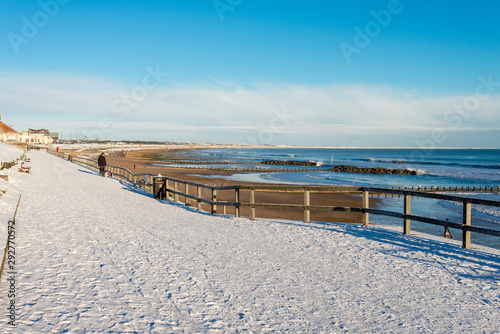 Promenade walk along Aberdeen city beach covered by snow  Scotland