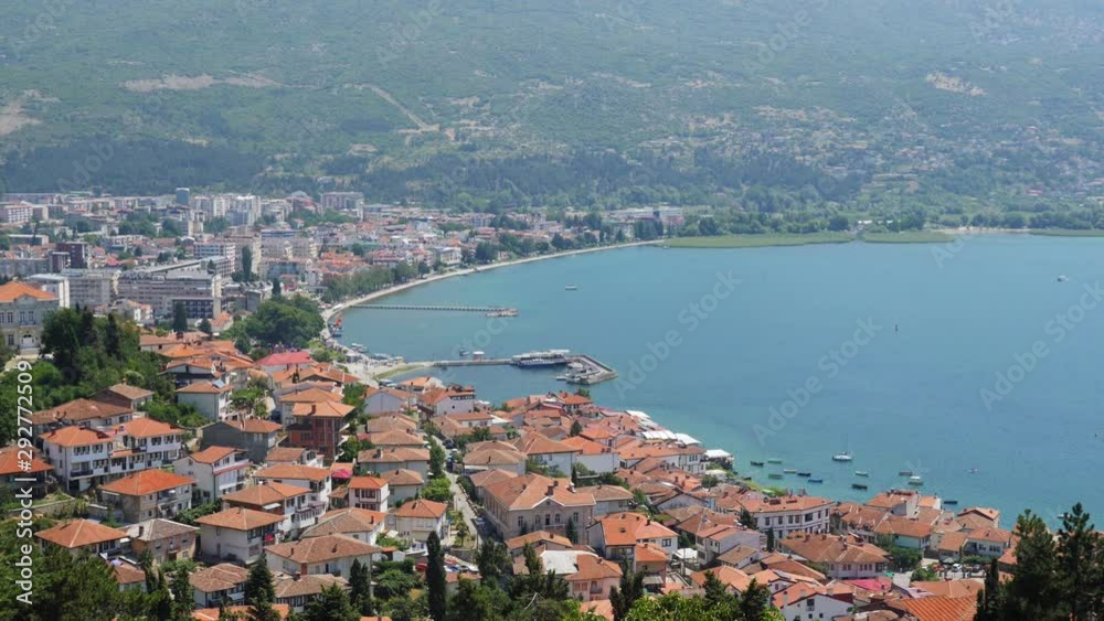 Pan left to right, showing the Lake Ohrid between Macedonia and Albania from a mountain. Pan left to right, showing the Lake Ohrid between Macedonia and Albania from a mountain.