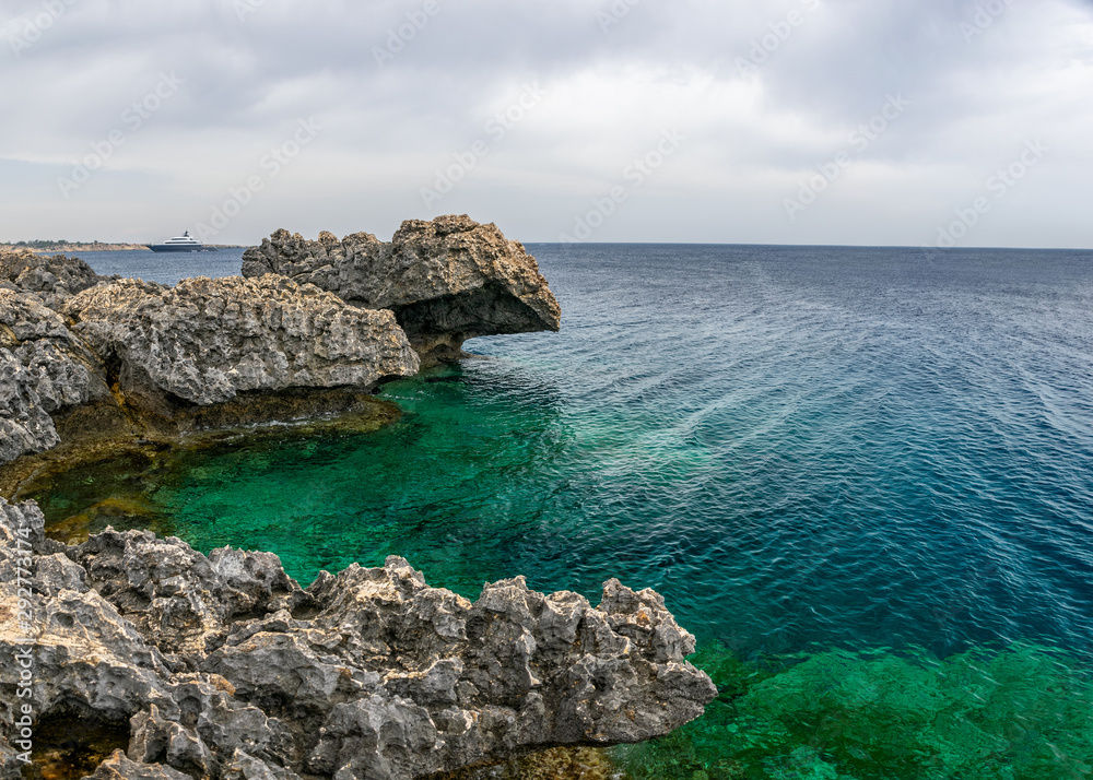 The rocky coast of the Mediterranean Sea on the island of Cyprus.