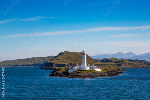Eilean Musdile Lighthouse as Seen from the Isle of Mull Ferry photo