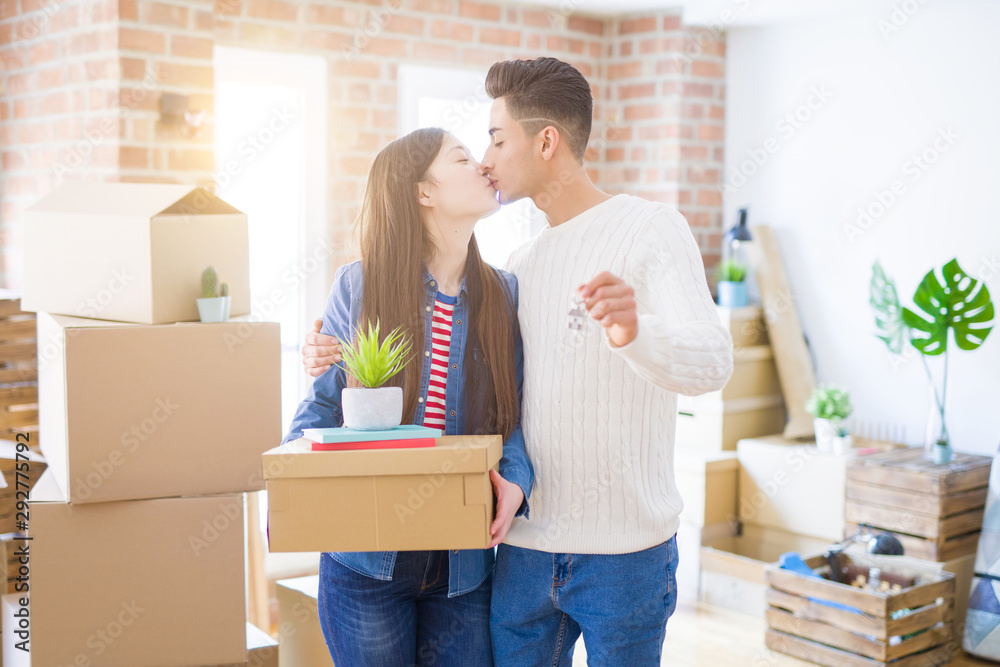 Young asian couple holding keys of new house, smiling happy and excited moving to a new apartment Young asian couple holding keys of new house, smiling happy and excited moving to a new apartment