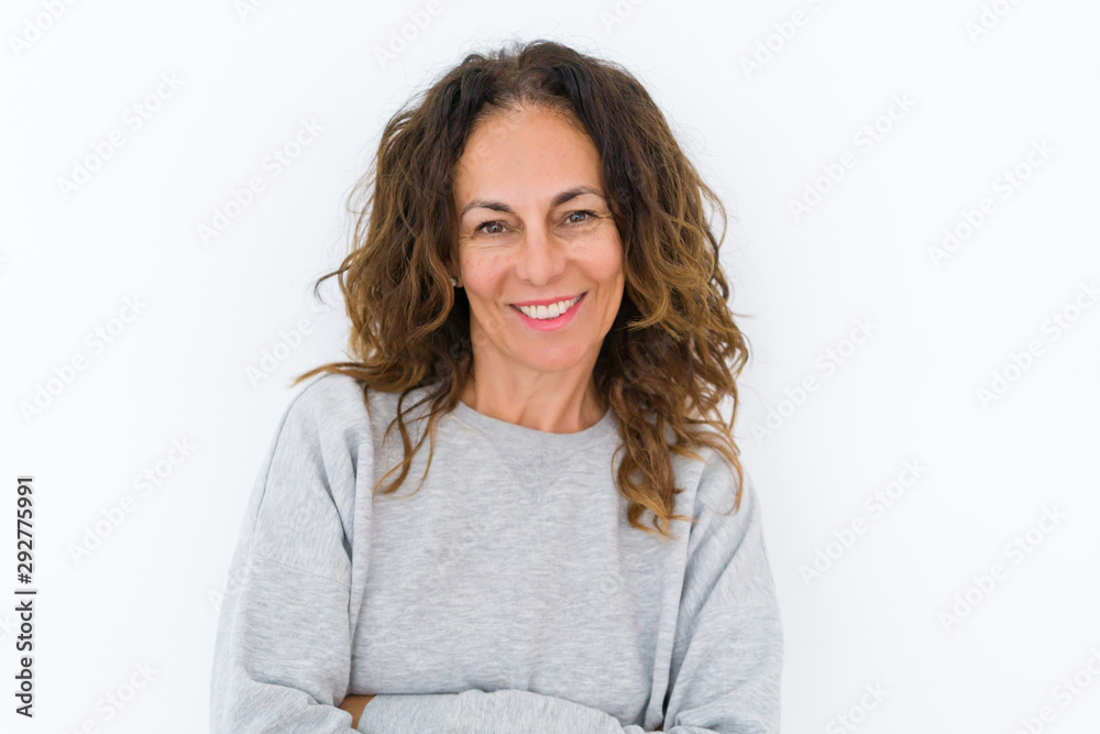Beautiful middle age woman with curly hair smiling cheerful and happy, laughing with a big smile on face showing teeth Beautiful middle age woman with curly hair smiling cheerful and happy, laughing with a big smile on face showing teeth