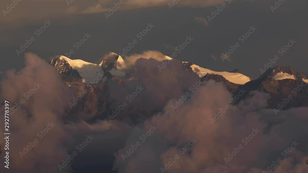 Mountains between moving clouds, Pico Cristobal Colon, Pico Simon Bolivar, Highest peaks of Colombia at 5700 meters of elevation