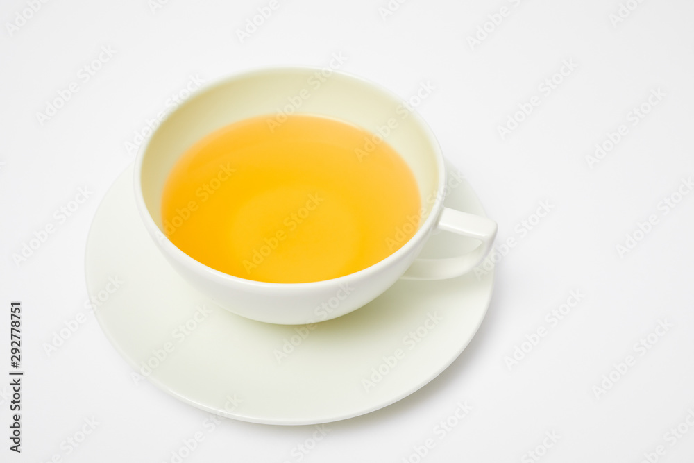 Herbal tea in a white cup isolated on white Herbal tea in a white cup isolated on white