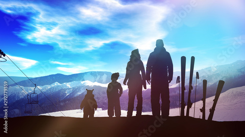 Family with children on a ski slope.