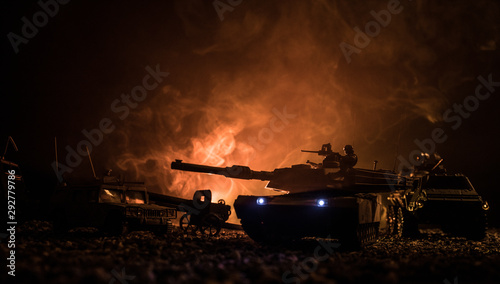 Military patrol car on sunset background. Army war concept. Silhouette of armored vehicle with soldiers ready to attack. Artwork decoration. Selective focus