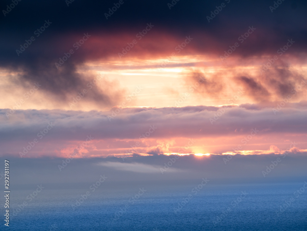 sunset with clouds in the sea