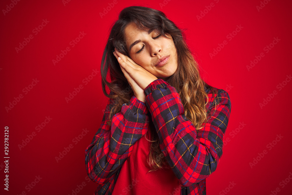 Young beautiful woman wearing casual jacket standing over red isolated background smiling positive doing ok sign with hand and fingers. Successful expression. Young beautiful woman wearing casual jacket standing over red isolated background smiling positive doing ok sign with hand and fingers. Successful expression.