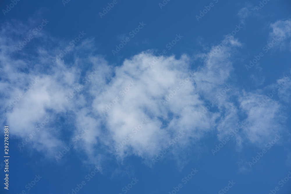 Blue sky and white clouds background. Clouds in the blue sky Blue sky and white clouds background. Clouds in the blue sky