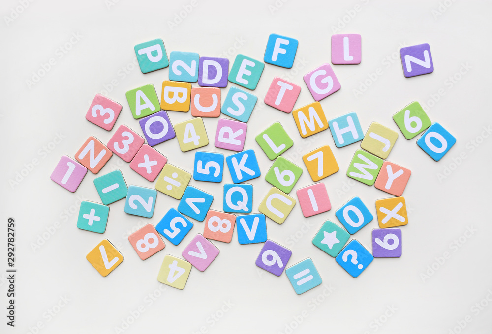 Multi-color Alphabet ABC letters and number and mathematics sign in square flat papers on white background.