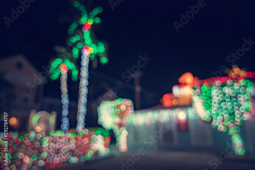 Seasonal Christmas House Lights Decoration, outdoor blurred defocused view. Xmas showcase. Tropical climate