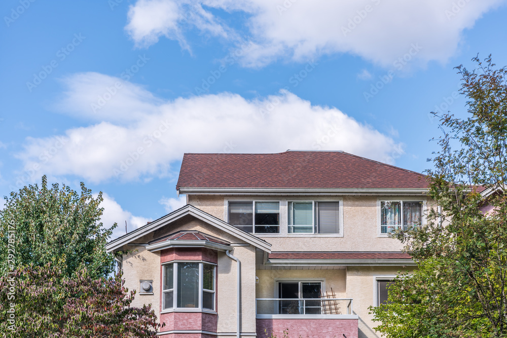 The top of an apartment building with nice windows. The top of an apartment building with nice windows.