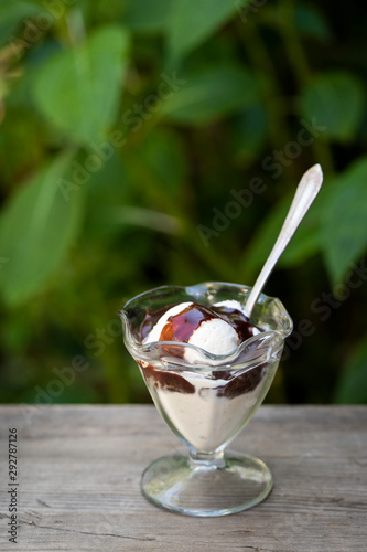 Vanilla ice cream with chocolate sauce photo