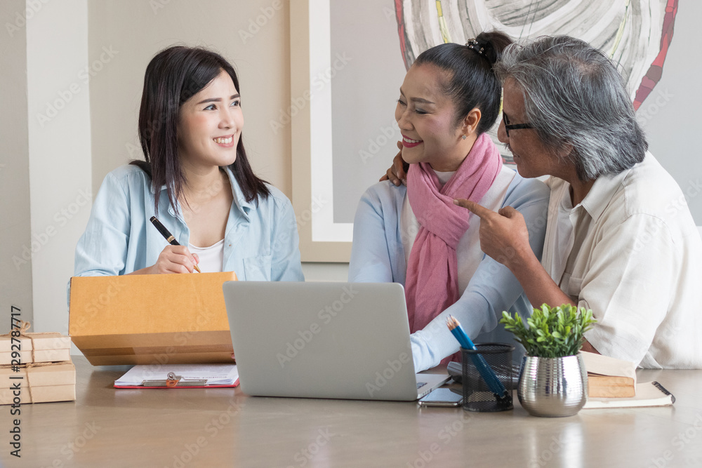 Senior couple and daughter are working at home using computers and laptops, with the internet communicating online with other people. Senior couple and daughter are working at home using computers and laptops, with the internet communicating online with other people.