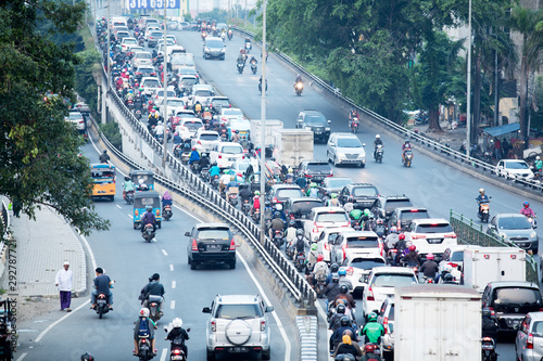 Crowded cars and motorcycles on hectic highway