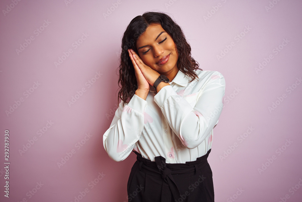 Transsexual transgender businesswoman standing over isolated pink background sleeping tired dreaming and posing with hands together while smiling with closed eyes. Transsexual transgender businesswoman standing over isolated pink background sleeping tired dreaming and posing with hands together while smiling with closed eyes.