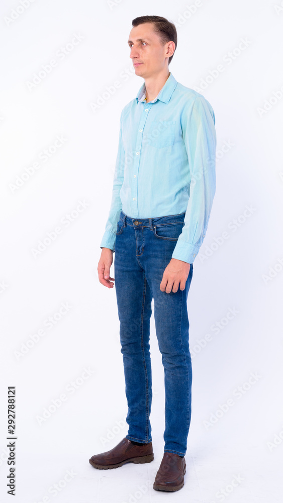 Full body shot of businessman thinking and looking away Full body shot of businessman thinking and looking away
