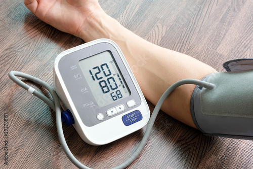 Doctor woman check blood pressure monitor and heart rate monitor pressure gauge. Health care and  Medical concept
