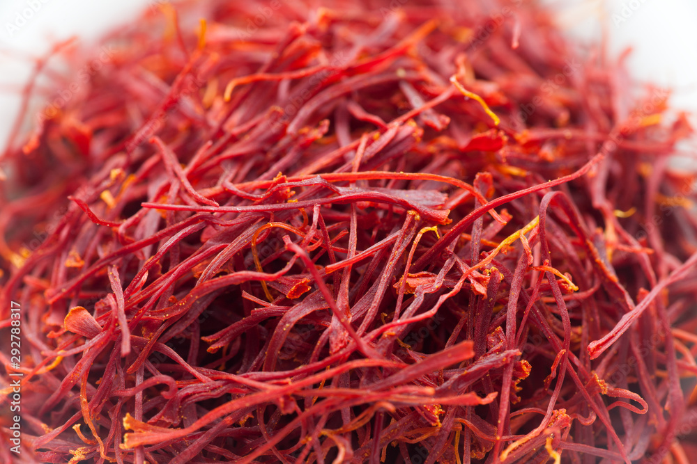 Fototapeta premium Closeup of dried saffron in a white ceramic cup