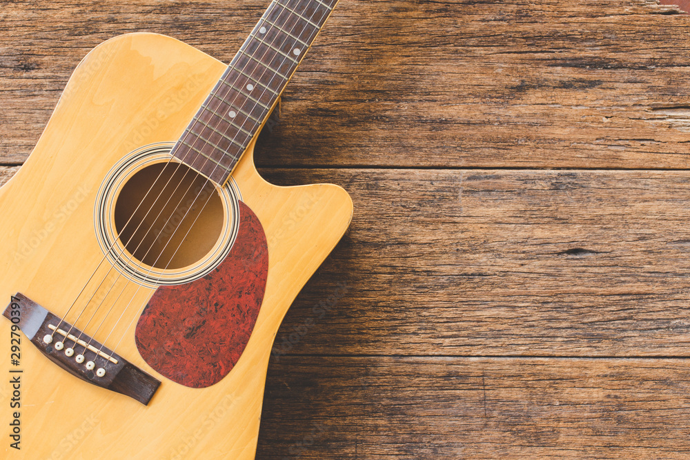 Top view of Acoustic guitar on wood background and copy space Top view of Acoustic guitar on wood background and copy space