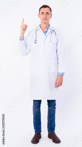 Full body shot of man doctor pointing up