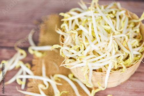 Close up Organic mung bean sprout for food - bean sprouts cup on wooden Background