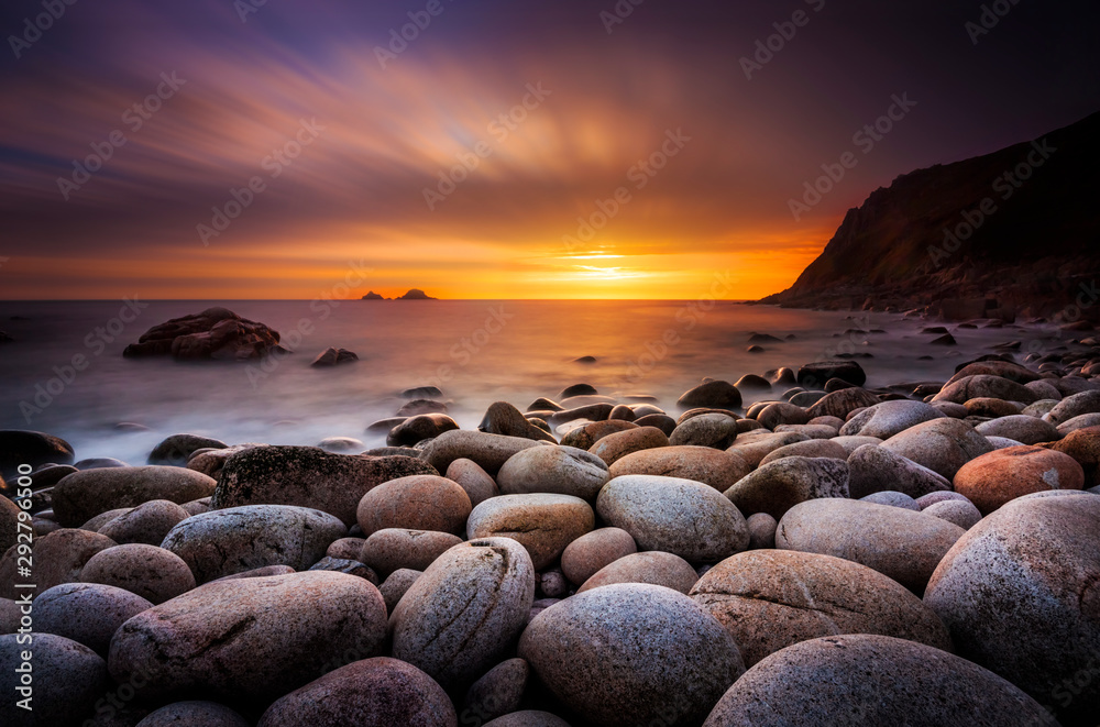 The sun sets at Porth Nanven in Cornwall - obrazy, fototapety, plakaty 