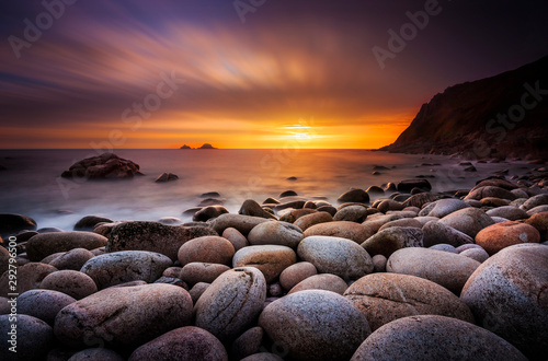 The sun sets at Porth Nanven in Cornwall © allouphoto