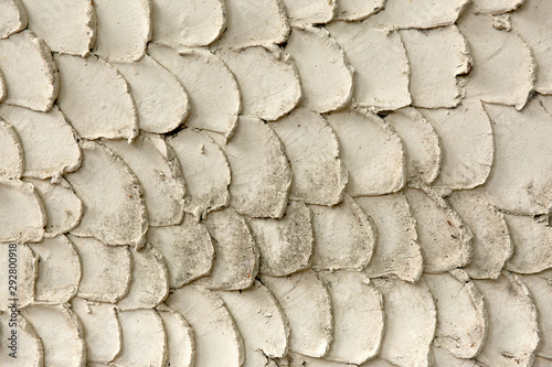 Beige plaster scales wall. Abstract background. photo