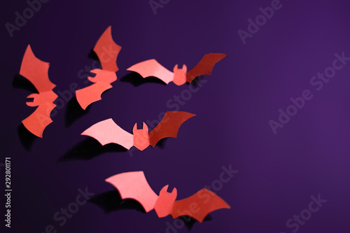 bat papercut in purple background fro halloween