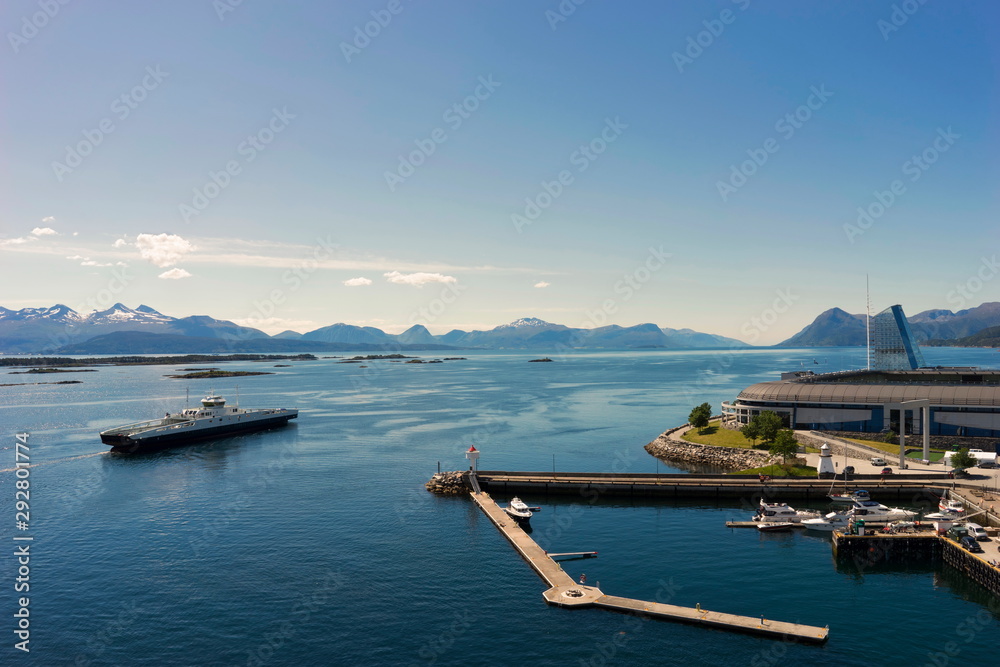 Sunset in Molde Bay and Aker Stadion in the background. Romsdal, Norway. View from open deck of cruise ship.