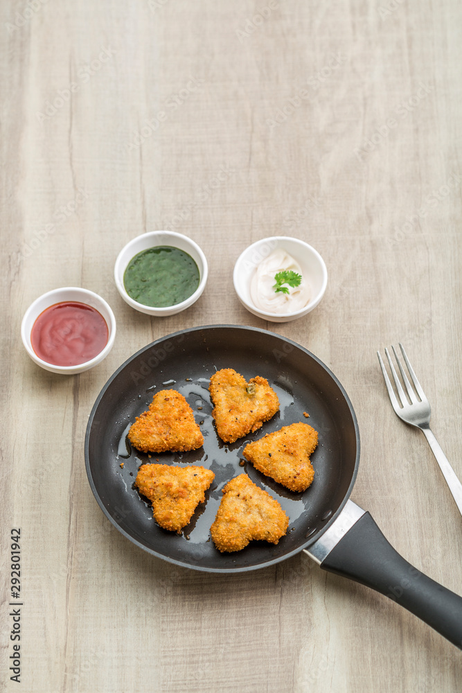 Heart shape cutlets with sauce and green chutney Heart shape cutlets with sauce and green chutney