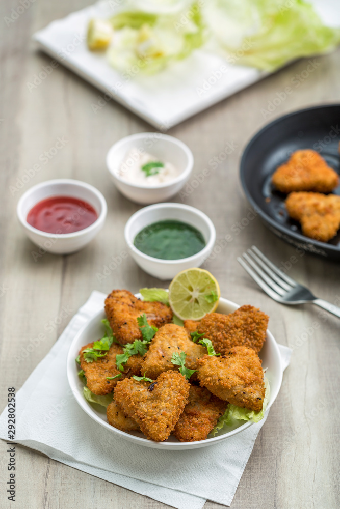 Heart shape cutlets with sauce and green chutney Heart shape cutlets with sauce and green chutney