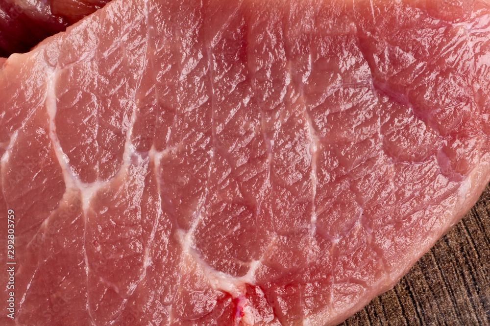 Coarsely chopped pieces of pork. Raw meat before cooking. The concept of cholesterol food. Flat sections with streaks of fat. Coarsely chopped pieces of pork. Raw meat before cooking. The concept of cholesterol food. Flat sections with streaks of fat.